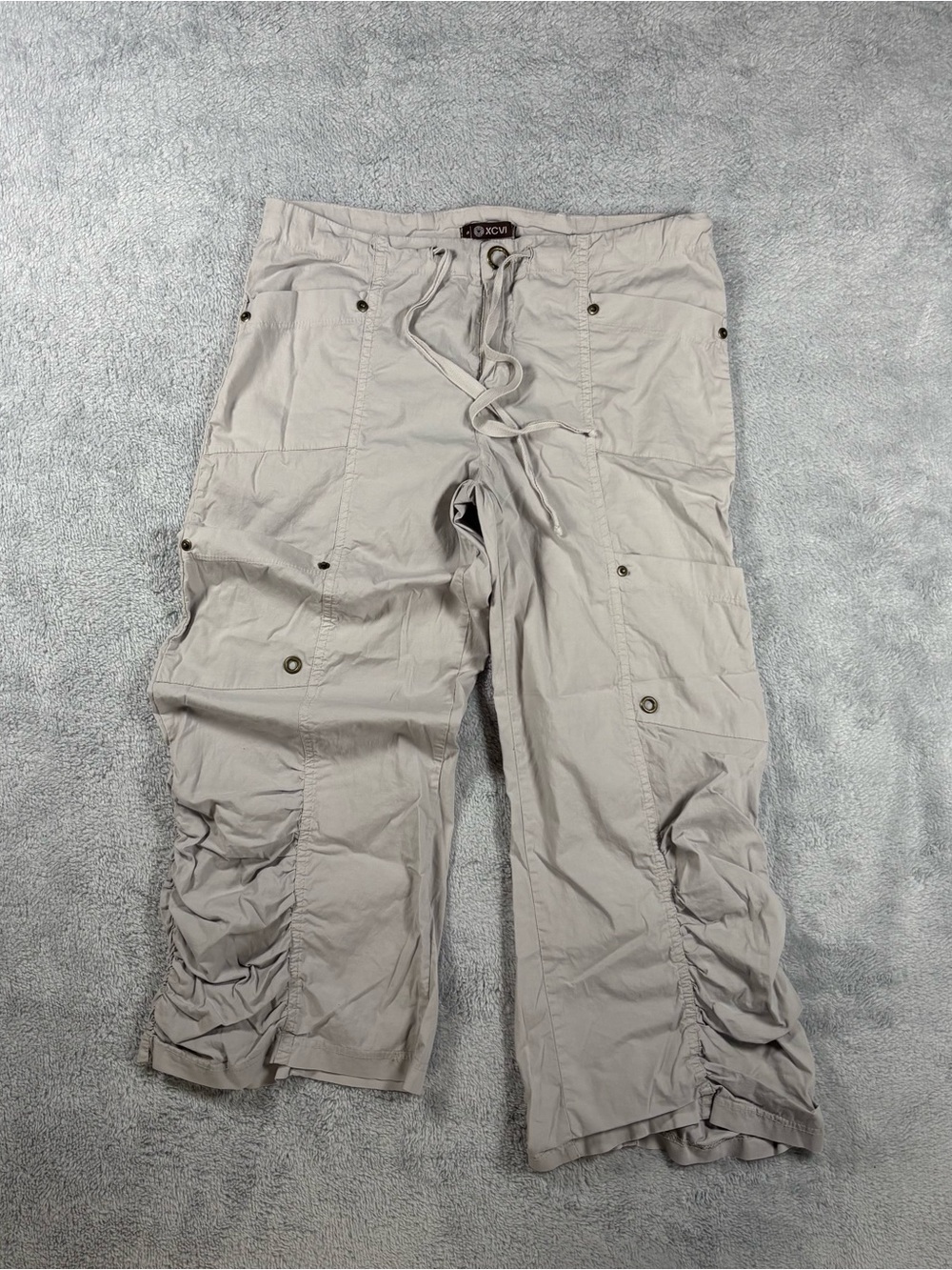 Y2K XCVI tan cargo pants with adjustable waist and pockets.